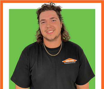 Josh, SERVPRO employee, cut out and set against a green backdrop