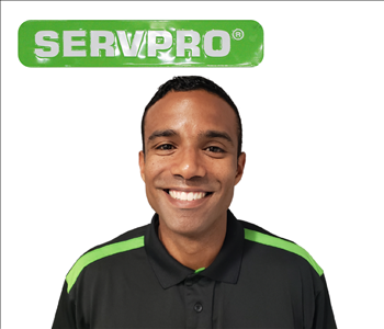 Eddie Urbina for SERVPRO photo in uniform; male employee in dark hair