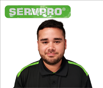 Eduin Suarez for SERVPRO photo in uniform; male employee with dark hair