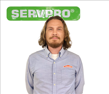 Christopher Price for SERVPRO photo; male employee wearing light blue shirt