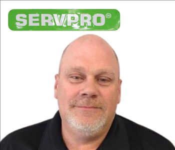 Kevin Woodard for SERVPRO photo on white wall