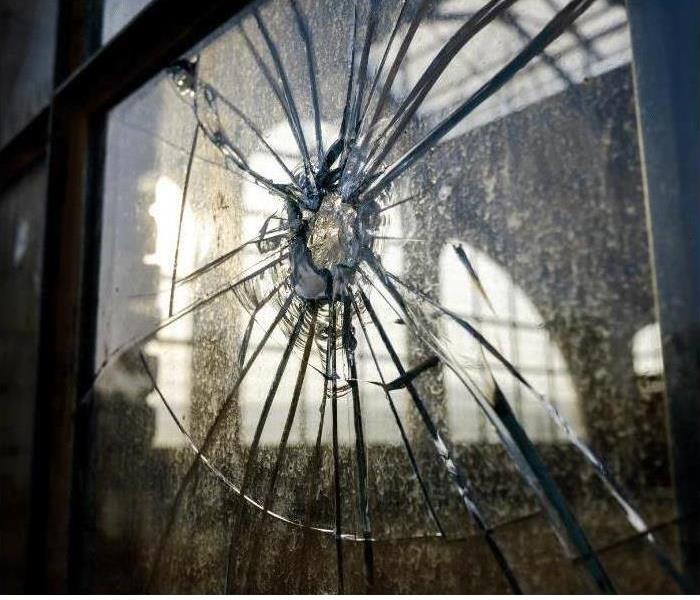 Call us today at (727) 521-2562. Image of broken glass.