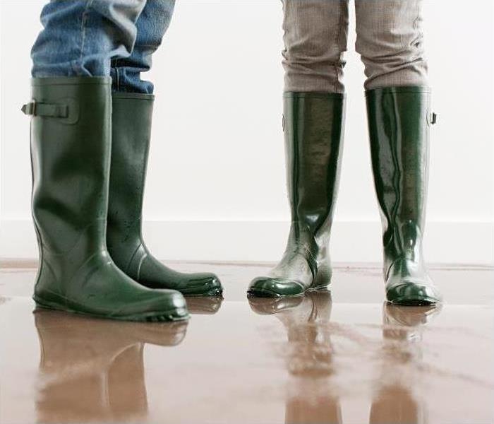 Have storm damage? Call SERVPRO of Central St. Petersburg / Pinellas Park today! Image of people standing in boots.