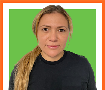 Female profile photo, against orange background