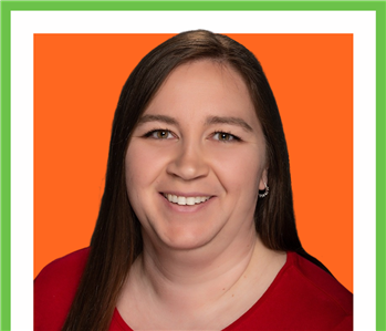 woman Posing for Company Photo against orange background